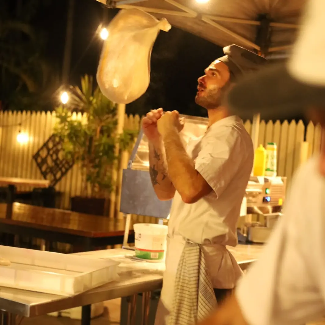 Dough tossed into the air